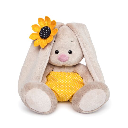 in a yellow polka-dot shorts and with sunflower in a yellow polka-dot shorts and with sunflower
