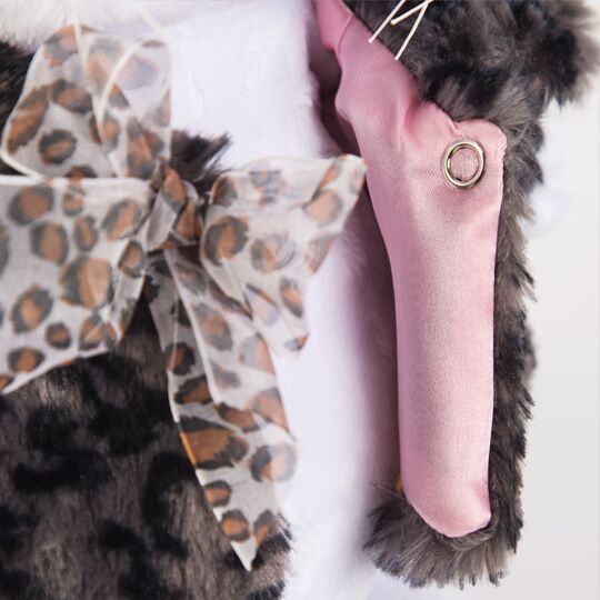 in fur coat with bow in fur coat with bow