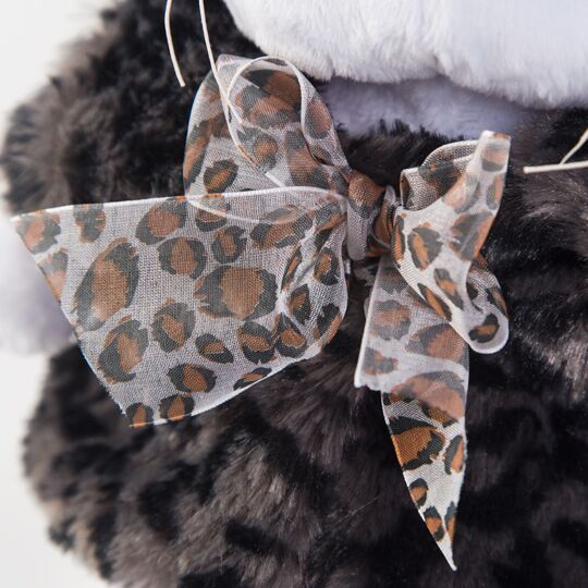 in fur coat with bow in fur coat with bow