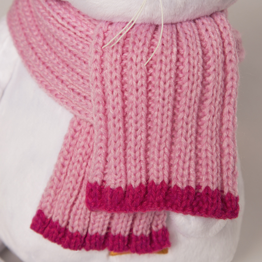 in pink hat and scarf in pink hat and scarf