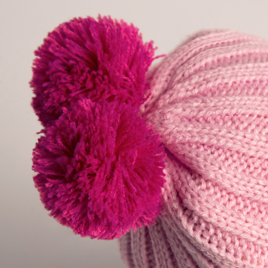 in pink hat and scarf in pink hat and scarf