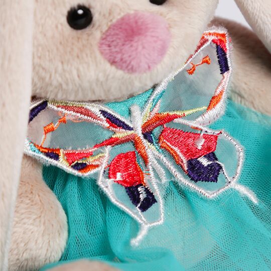 in turquoise skirt and with butterfly in turquoise skirt and with butterfly