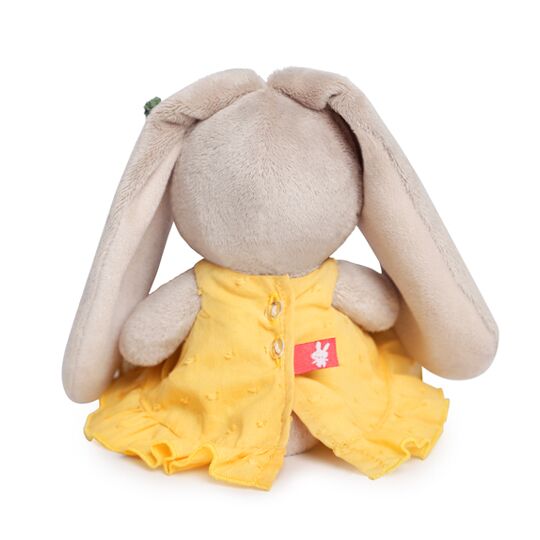 in a yellow sundress with carrot in a yellow sundress with carrot