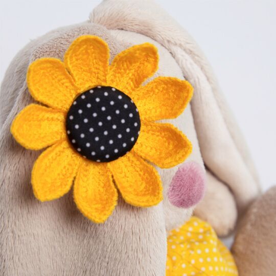 in a yellow polka-dot shorts and with sunflower in a yellow polka-dot shorts and with sunflower