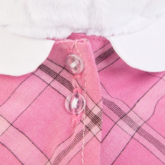 in pink dress with a grey purse in pink dress with a grey purse