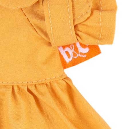 Оранжевый плащ и платье в разноцветный горох