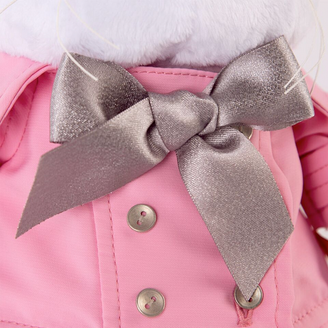in a pink cloak with a gray bow in a pink cloak with a gray bow