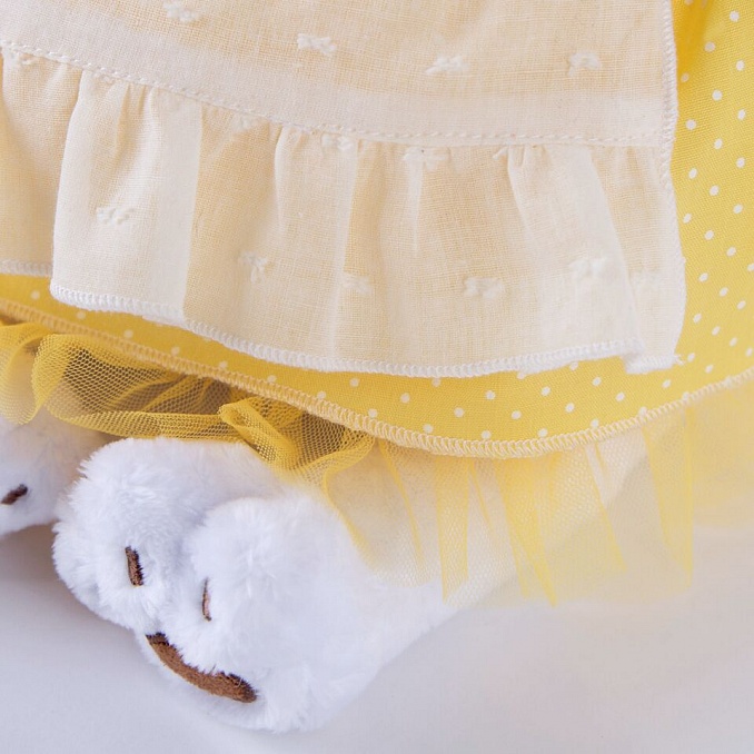 in yellow dress with pinafore in yellow dress with pinafore